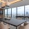 room with large table tv and large windows