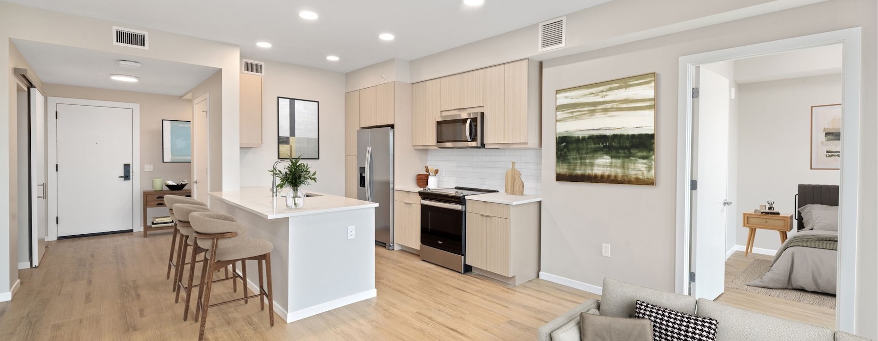 a kitchen with an island and chairs