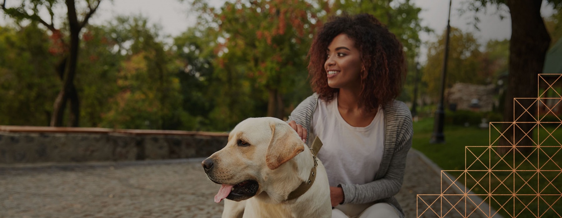 lifestyle image of a woman and her dog outdoors